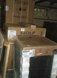 Appliances in their boxes in the garage